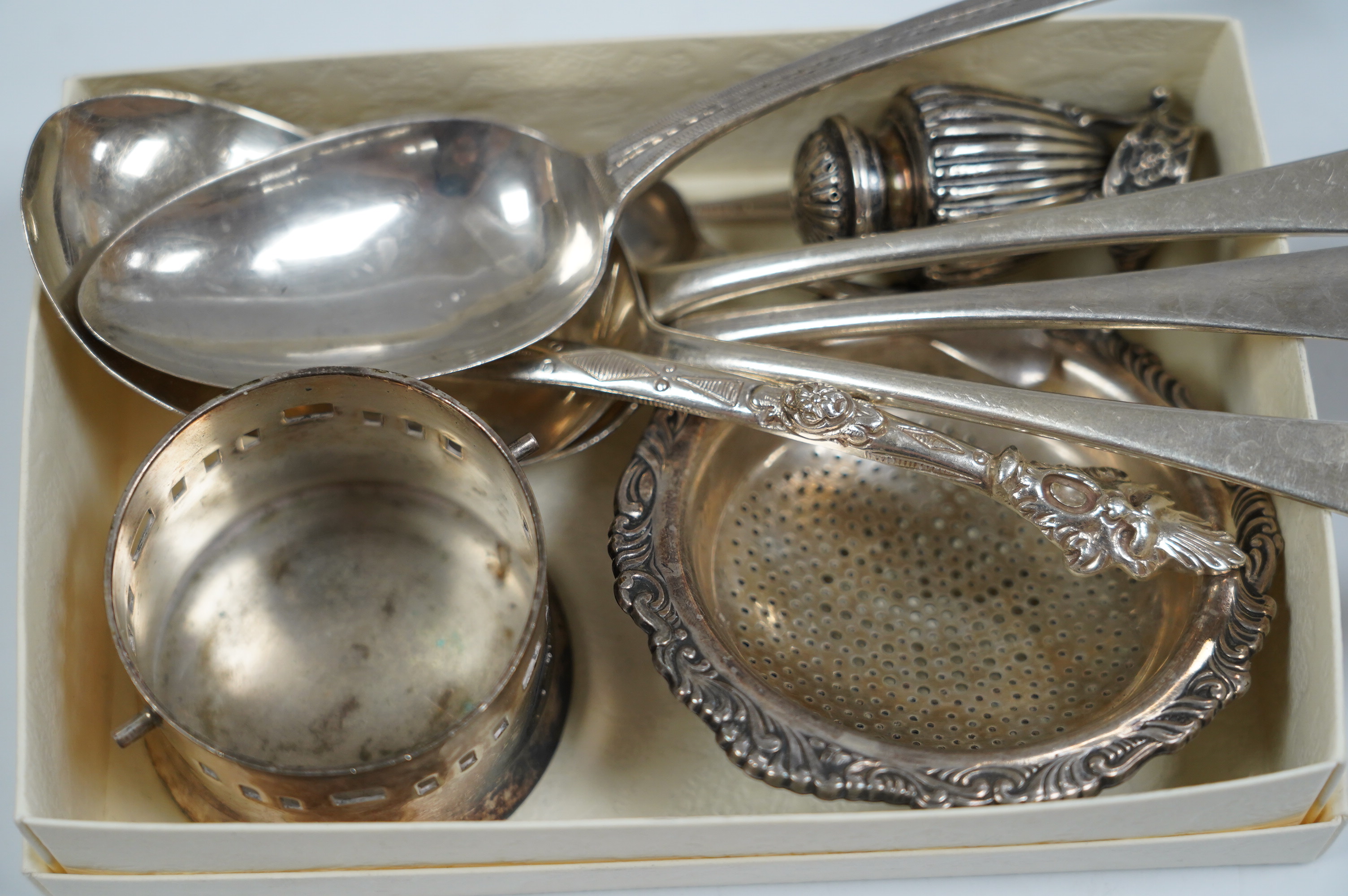 A small group of assorted mainly Georgian silver flatware and three other items, including a silver pepper. Condition - poor to fair